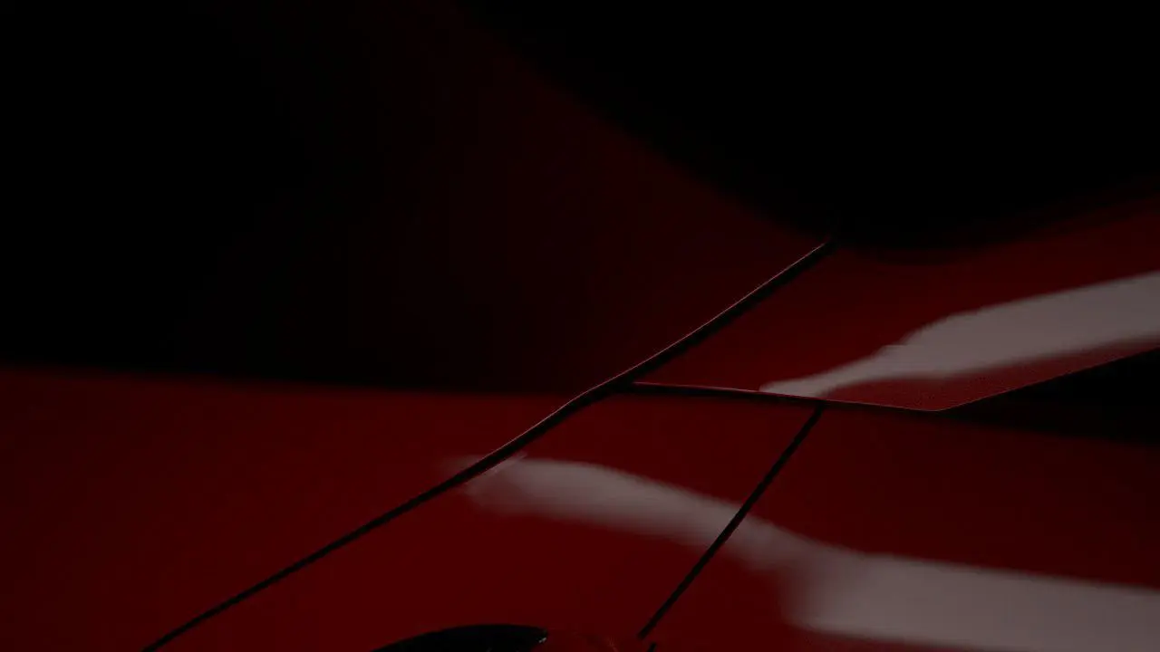 Деталь кузова Zenvo в красном свете